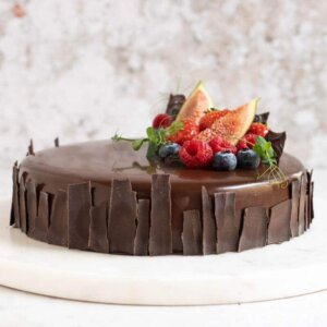 A chocolate mousse cake with a berry decoration