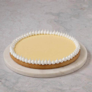 a lemon tart with a meringue top on the edge
