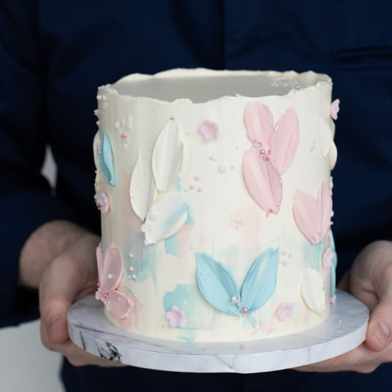 Baby shower cake with blue and pink accents